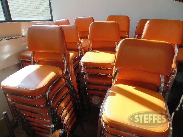 (150+/-) orange and black stack chairs